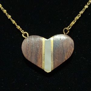 Wood with white/mother of pearl and gold-tone inlay necklace.